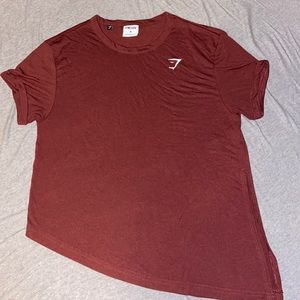 Woman’s Gymshark asymmetrical hem maroon athletic tee